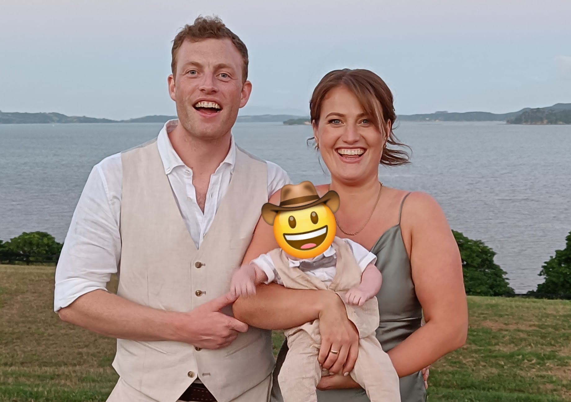 The AgTag founders — a farmer and a software engineer — outdoors with their child.